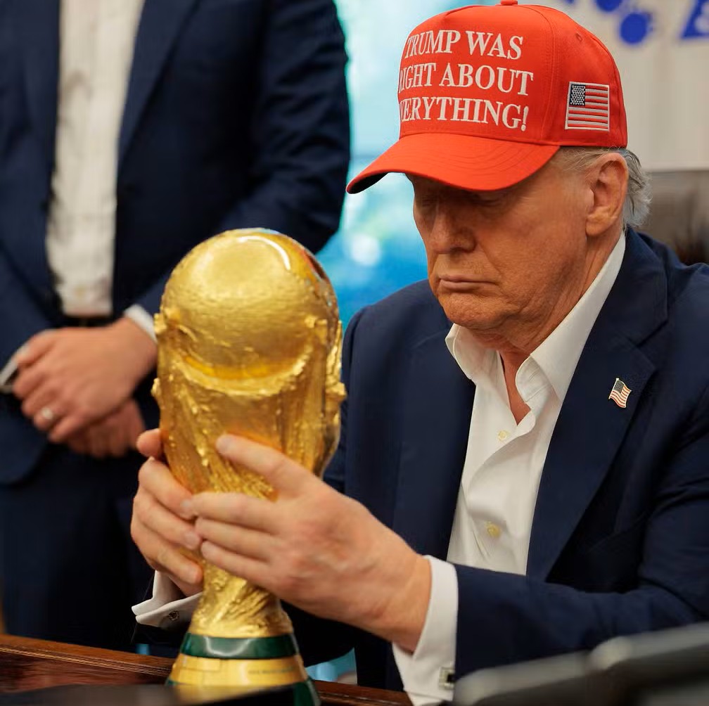 112090954-washington-dc-august-22-us-president-donald-trump-holds-the-world-cup-trophy-in-the-oval.jpg